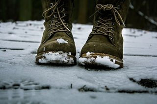 a person with boots in the snow