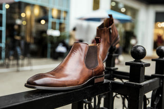 A pair of brown Chelsea boots
