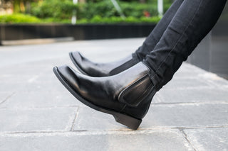 a pair of black leather shoes